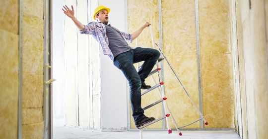 man falling off ladder on construction site